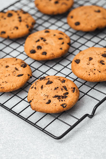 istock Freshly baked chocolate chip cookies cooling on a wire rack in the kitchen 2253293505