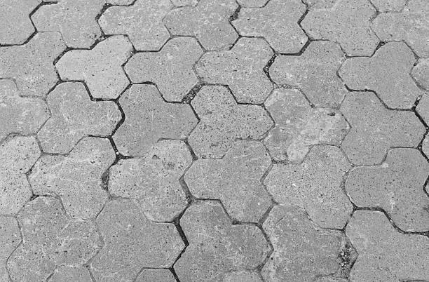 Close up of concrete pavement tiles with hexagonal pattern for construction and urban design concept