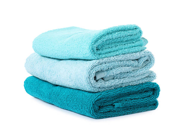 istock Stack of fresh terry towels isolated on white 2253295171