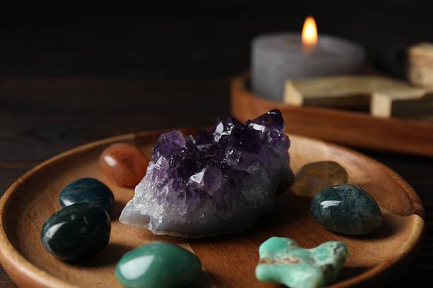 istock Different beautiful gemstones on wooden table, closeup 2253295704