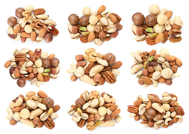 istock Nuts mix in heaps isolated on white, set. Top view 2253295835