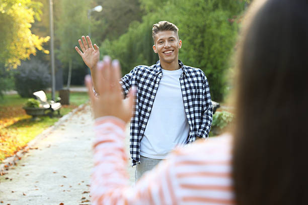 istock Man waving goodbye to his friend in park, selective focus 2253295994