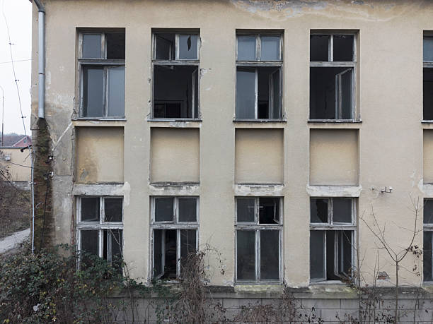 front facade with broken windows