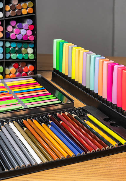 istock Colorful pencils, markers, felt-tip pens on table. Bright creative background for education, school, art, design, stationery, office, learning, childhood creativity, inspiration 2253300363