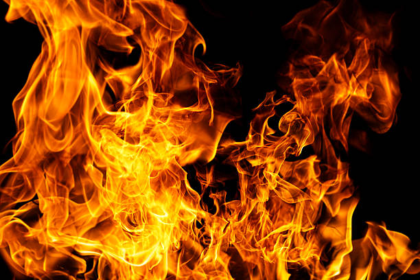 istock Flame pattern. Flames on black backdrop. Glowing flames on black background. Inferno effect with flame. Blazing fire. Flame abstract design. Intense blazing fire background. 2253301144