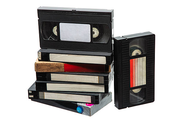 istock Stack of five vintage VHS tapes standing upright, isolated on a clean white background. 2253302471