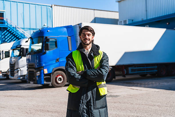 istock Truck driver in cold storage warehouse smiling at camera 2253302600