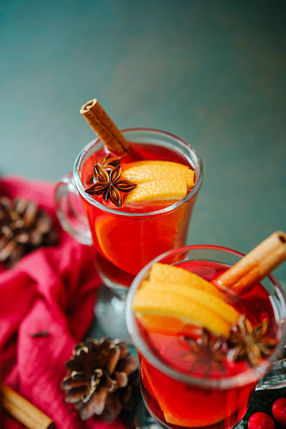 istock Warm winter drink mulled wine with orange slice cinnamon stick star anise 2253302701