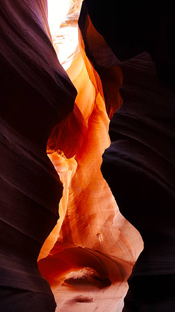 istock Sunlit Sandstone Formations Inside a Narrow Slot Canyon 2253302933