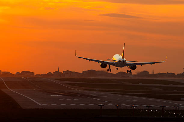 istock Passenger airplane landing at dusk 2253303508