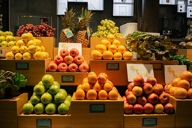 Fresh Fruit Display with Oranges, Apples, and Pineapples in Grocery Store