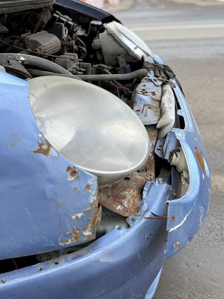 istock Blue Hatchback Collision Evaluation, Evaluation Of Blue Vehicle With Broken Parts After Crash, Assessment Of Accident Involving Blue Hatchback With Damaged Components On Slick Pavement 2253306857