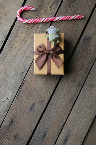 Vintage gift box with bow on vintage wooden background.