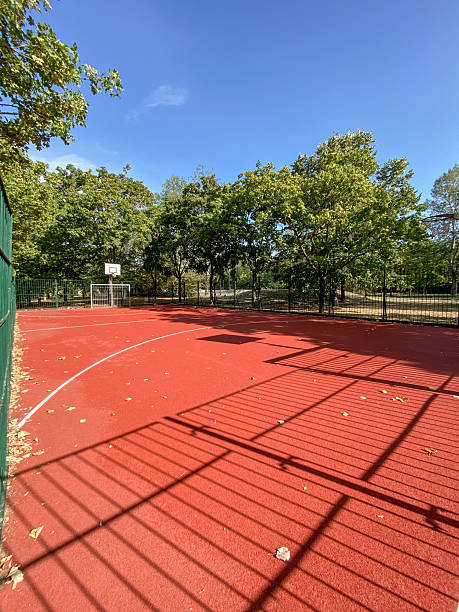 istock empty outdoor basketball court with red surface 2253311062