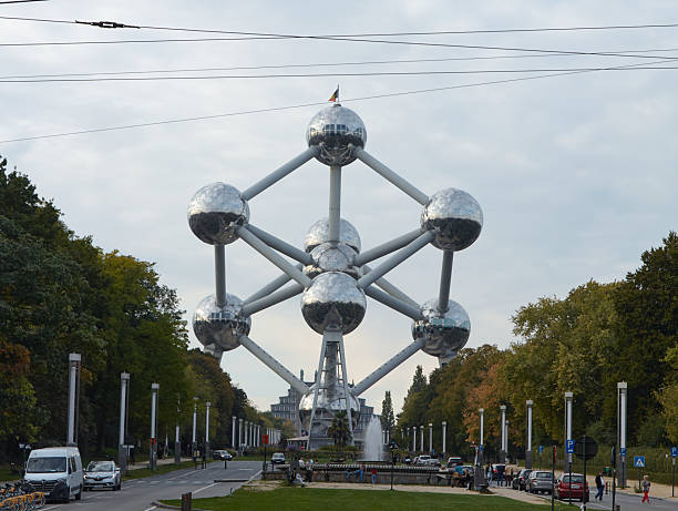 Brussels, Belgium - October 01, 2025: View of the Atomium in Brussels from Laken Park, highlighting its unique design and the lush landscape around it
