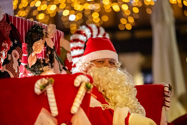 Christmas parade with Santa Claus on a float. Christmas 2025 in the main square of Tordesillas. Tordesillas, Valladolid, Castile and León, Spain, Europe - December 23, 2025.