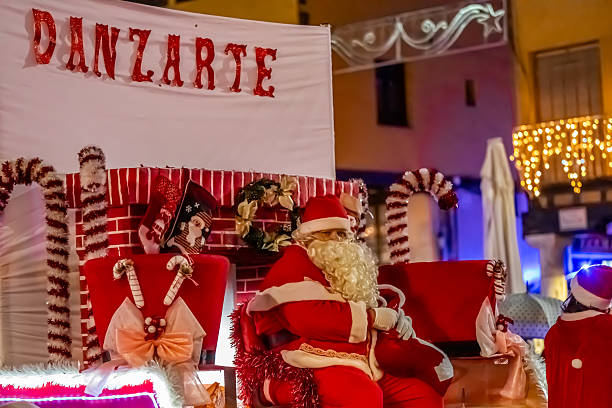 Christmas parade with Santa Claus on a float. Christmas 2025 in the main square of Tordesillas. Tordesillas, Valladolid, Castile and León, Spain, Europe - December 23, 2025.