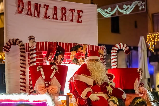 Christmas parade with Santa Claus on a float. Christmas 2025 in the main square of Tordesillas. Tordesillas, Valladolid, Castile and León, Spain, Europe - December 23, 2025.