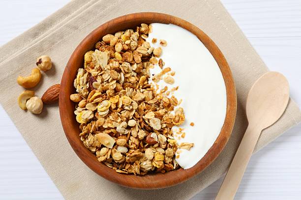 istock Delicious granola with yogurt on a light background 2253312393