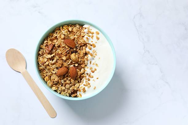istock Delicious granola with yogurt on a light background 2253312401