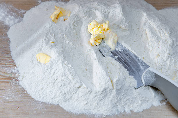 istock Kneading traditional dough for meat dumplings for Christmas, making dough with flour, eggs, and butter, 2253313086