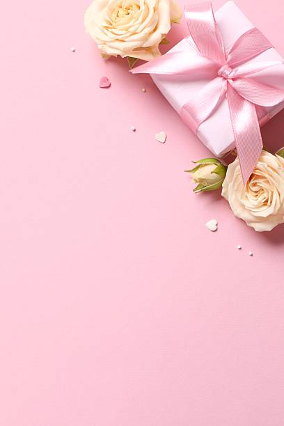 istock Beautiful composition with peony roses and gift box  on pink background 2253313755