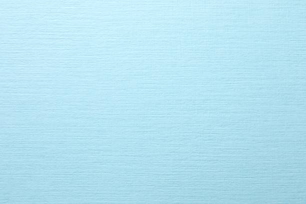 Blue paper background, abstract colored background, top view and flat lay