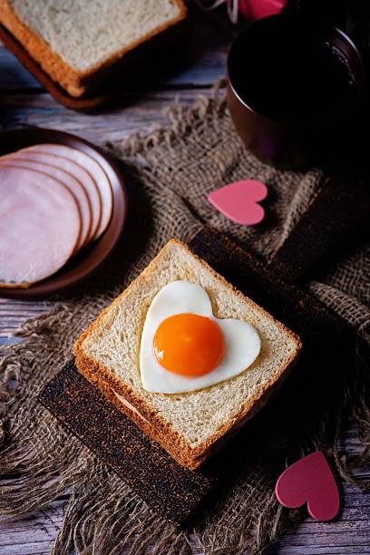 istock Heart shaped fried egg sandwich with ham and heart for Valentine's Day 2253314435