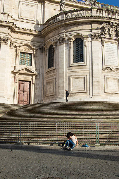 Caucasian adults visiting urban marble steps