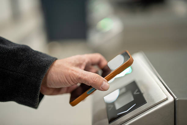 istock Person paying for public transport using mobile payment 2253320161