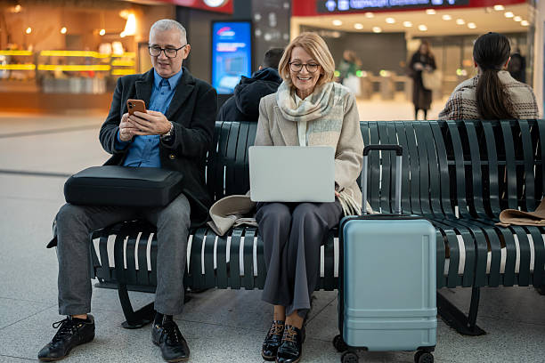 istock Mature couple traveling using technology at airport 2253320177