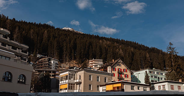 Arosa, the alpine winter resort with several residential buildings captured during winter season.