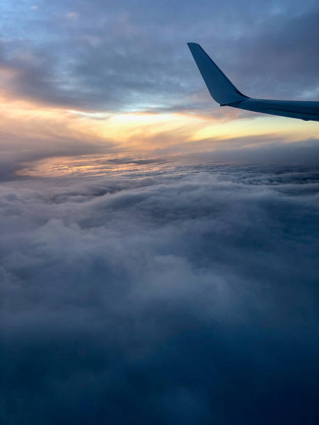istock Window views from aircraft above the clouds 2253330999