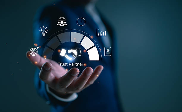 istock Trust partner concept, with a handshake in the middle of digital interface and floating icons, showing reliability and collaboration in business relationships. 2253332839