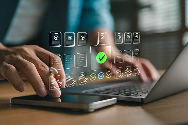 istock Dynamic photograph showing AI-driven document verification and compliance with holographic checkmarks for efficient business processes and auditing. 2253332842