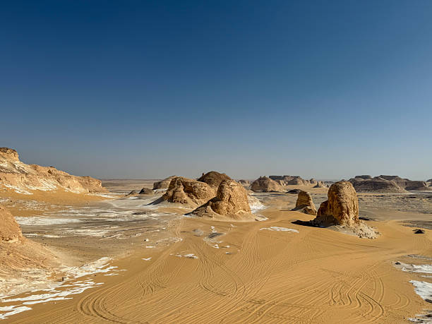 istock Sandy Desert Valley With Rock Formations In Sahara Egypt 2253335776