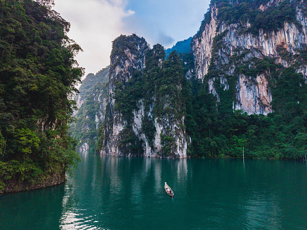 istock Explore stunning Cheow Lan Lake surrounded by dramatic cliffs in Khao Sok Thailand 2253339483