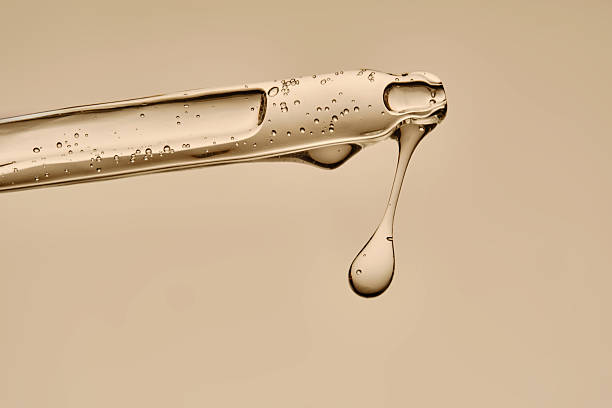 istock Serum in a pipette close-up on a beige background. 2253341334