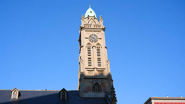 istock Historic clock tower architecture against blue sky in Cincinnati Ohio 2253342954