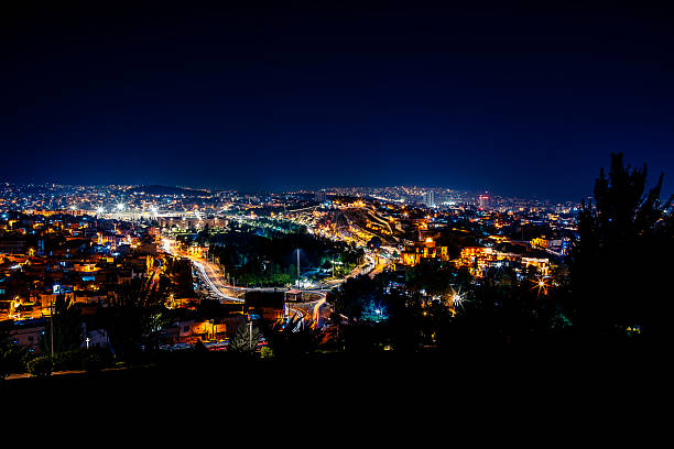 Nighttime Cityscape Highlighting Electrical Power and Technology