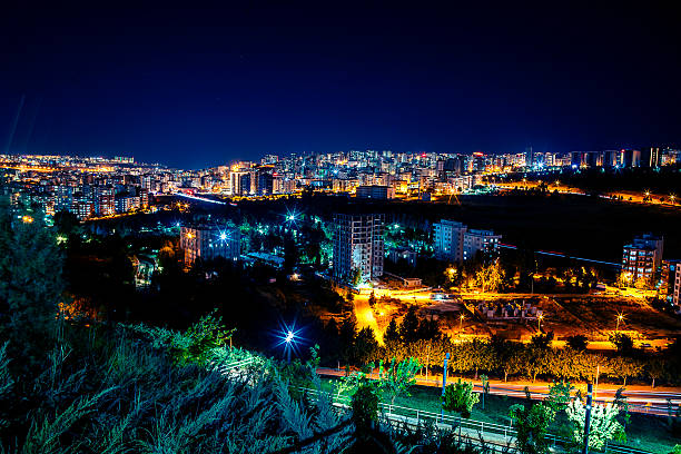 Nighttime Cityscape Highlighting Electrical Power and Technology