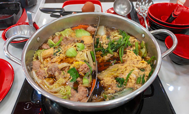 istock boiling meat and vegetables in hot pot 2253345430