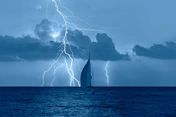istock Sailing yacht in a stormy weather with thunder and lightning 2253346609