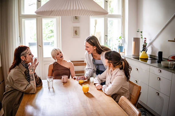 istock Young women share time at home, enjoying drinks and conversation during the weekend 2253347532
