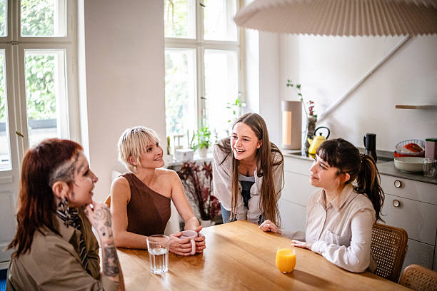 istock Young women spend time together at home while enjoying drinks and sharing laughs during a weekend gathering with friends 2253347637
