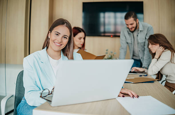 istock Group of coworkers collaborating on projects in a modern office space during working hours 2253349835