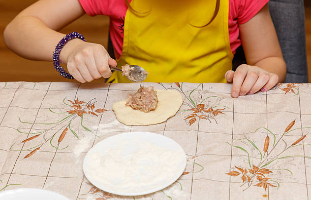 istock A girl is making a sandwich on a table 2253352177