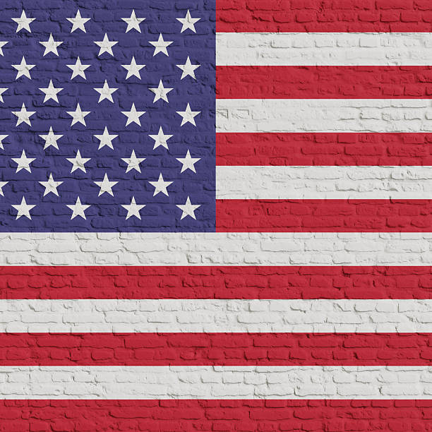 istock Brick Wall With Flag Of USA 2253352829