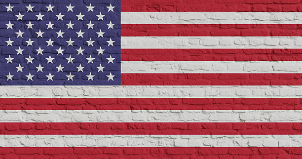 istock Brick Wall With Flag Of USA 2253352842