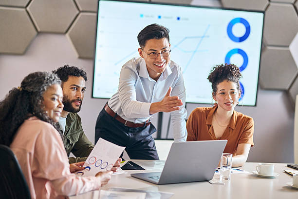 istock Diverse Team Brainstorming and Smiling in Data Review Meeting 2253353883